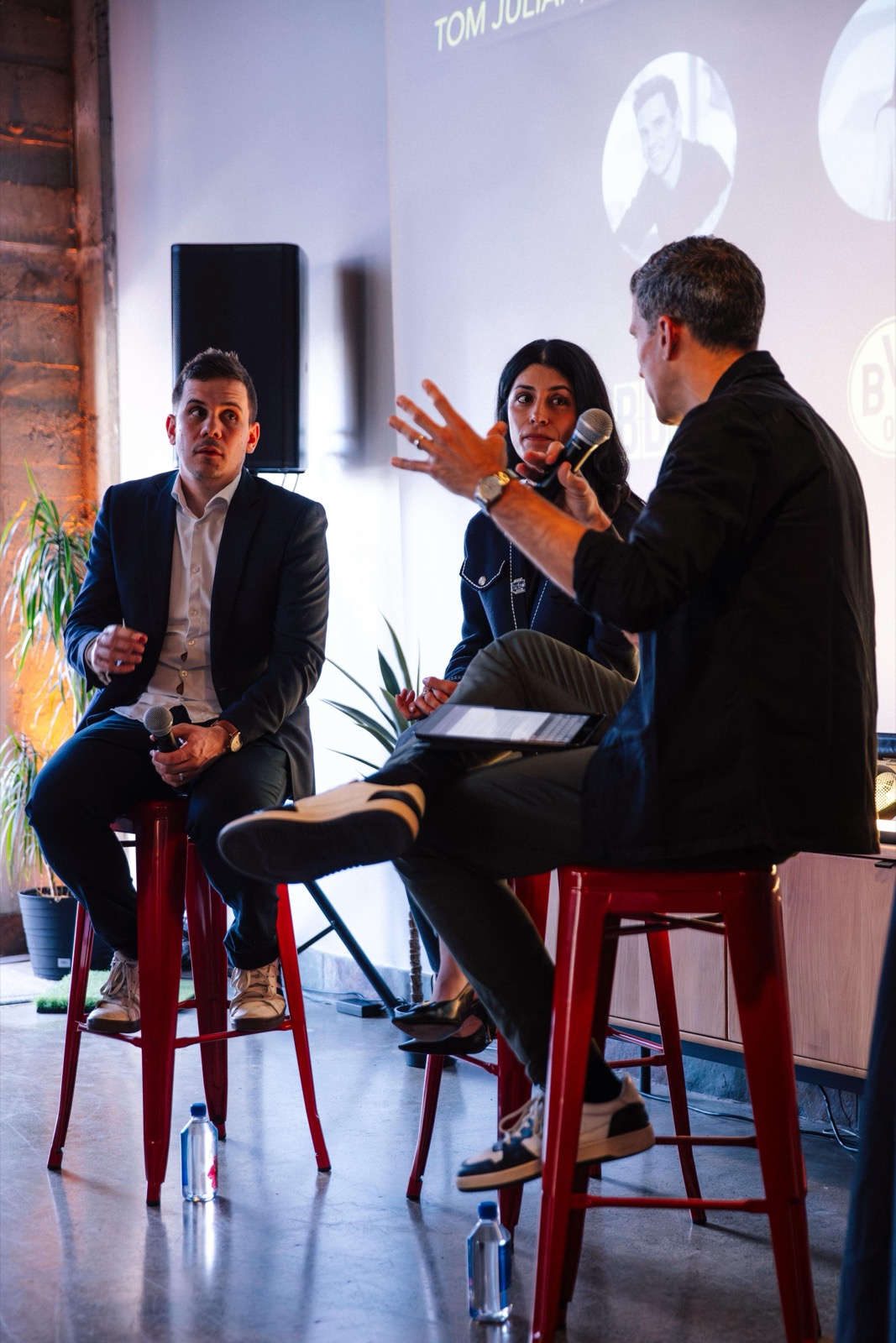 Talks on stage at House of AI