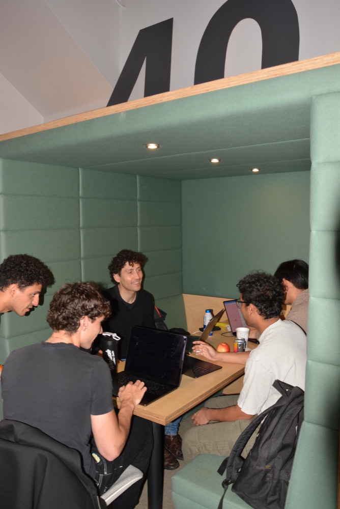 Team brainstorming together in a meeting nook