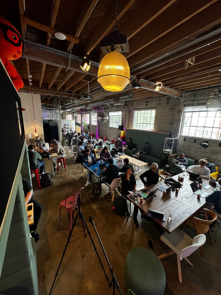 Overhead view of teams spread across the open floor space